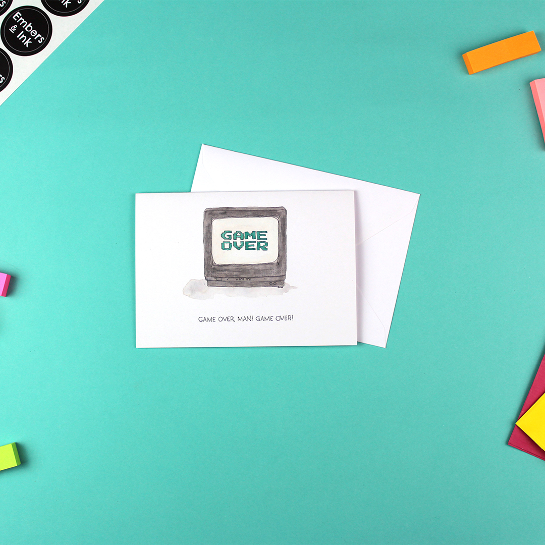 The game over card is shown with its white envelope