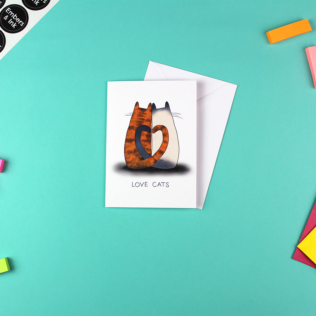 The 'Love cats' card is show next to a white envelope