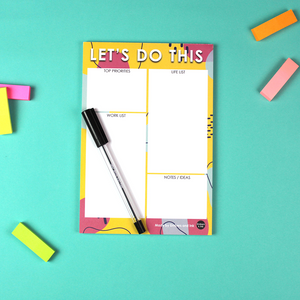 The Let's Do this Notepad is pictured with a pen on top to give context.
