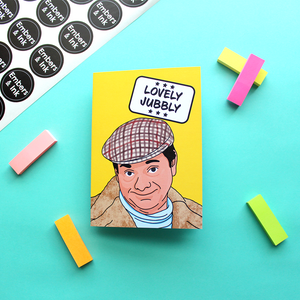 a yellow card with an illustration of Del Boy from a well known 80s TV programme. Above him in a white box are the words ‘Lovely Jubbly’