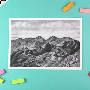 Image shows a landscape orientated print of a charcoal drawing of the Cuillin ridge on the Isle of Skye. It is a mountain range.