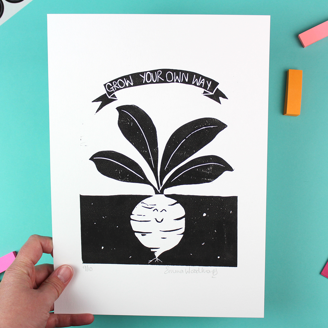 A hand holds the Grow Your Own Way print to reveal it is signed and numbered.