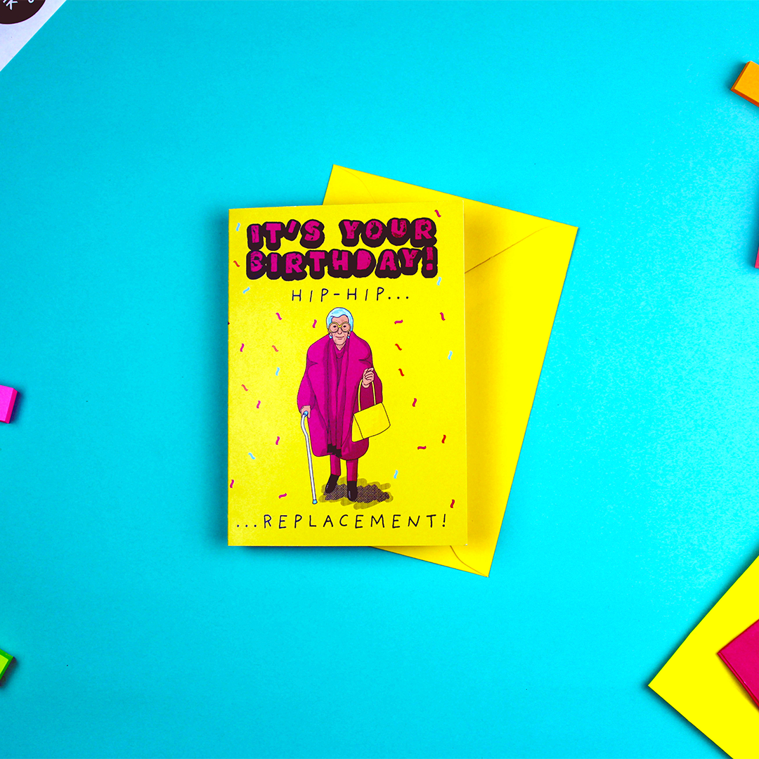 A bright and funky Birthday card featuring an older person dressed in pink with a yellow handbag next to the words 'It;s Your Birthday! Hip Hip ... Replacement!' Printed on recycled card and sent plastic free.