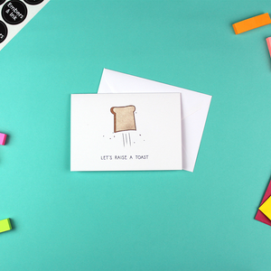The raise a toast card is shown next to a white envelope.