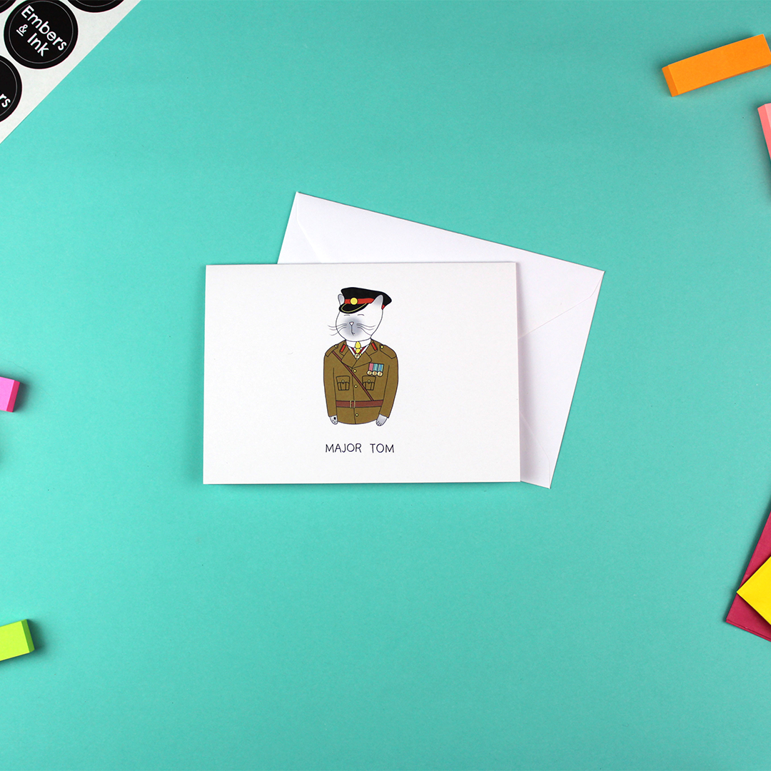 The Major Tom card is shown with a white envelope.