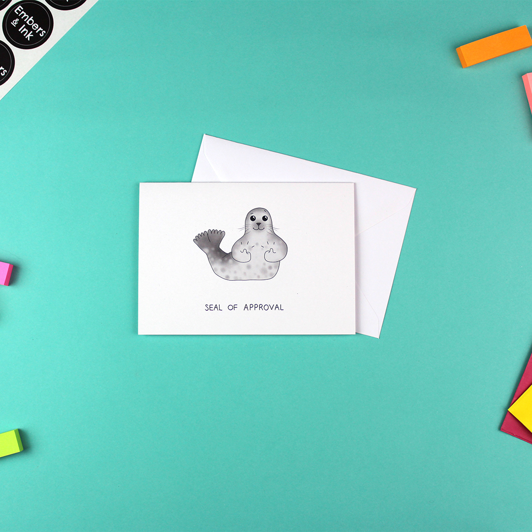 The Seal of Approval Greetings Card is shown with its white envelope.