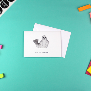 The Seal of Approval Greetings Card is shown with its white envelope.