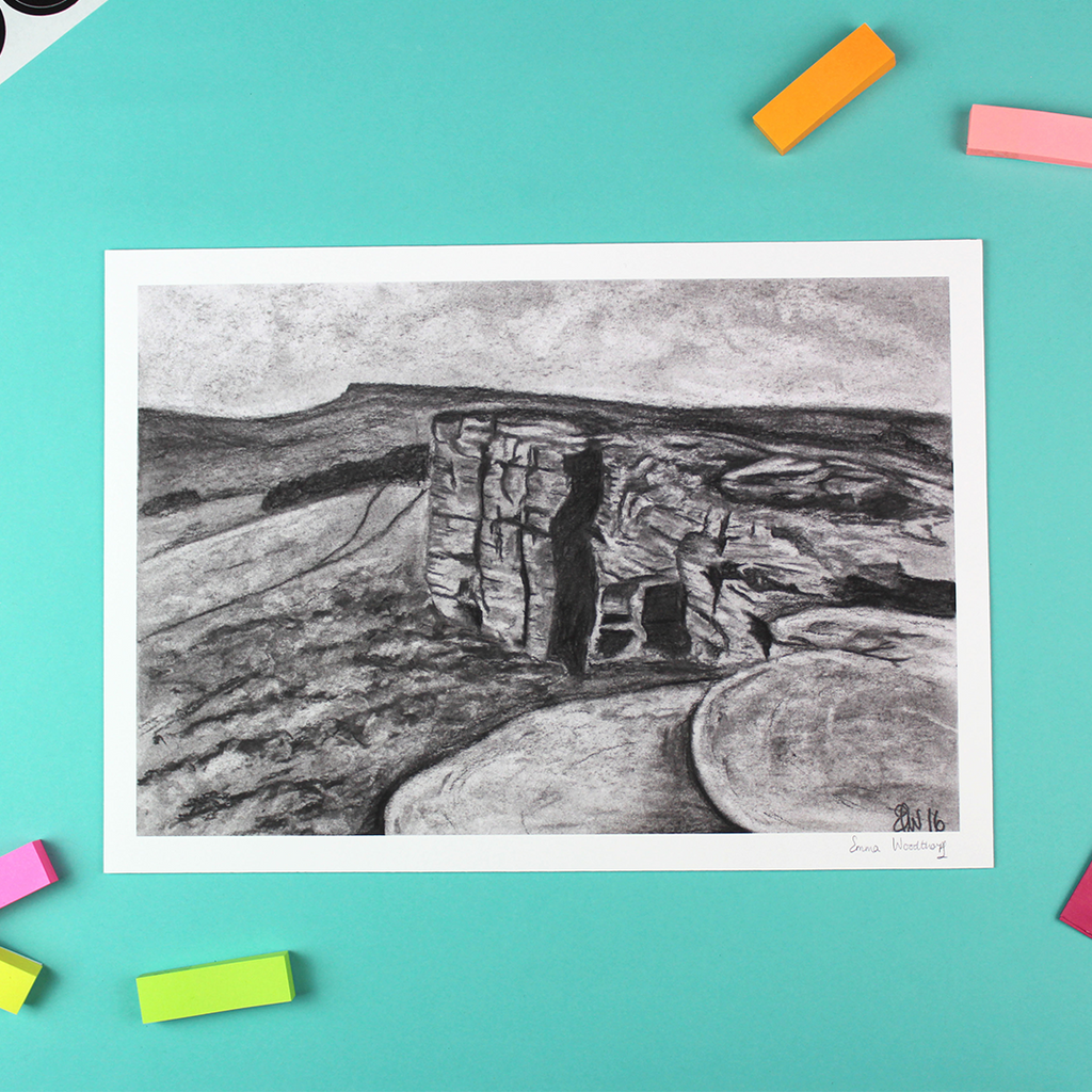 Image shows a landscape orientated print of a charcoal drawing of a peak district landscape of stanage edge.