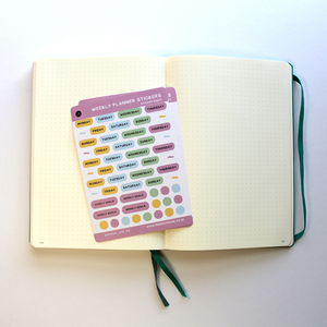 The sticker sheets are shown resting on an open journal ready for some planning or bullet-journalling.